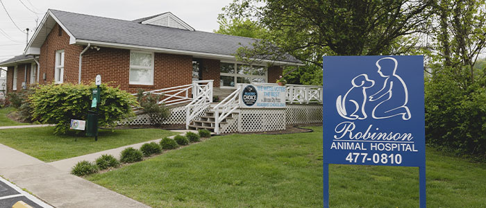 Brick building of Robinson Animal Hospital with a prominent entrance sign.